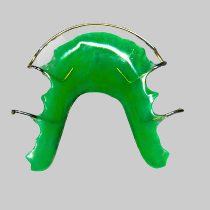 Green retainer with metal wires.