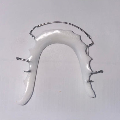 Lower Hawley retainer featuring sleek white acrylic and stainless steel wire